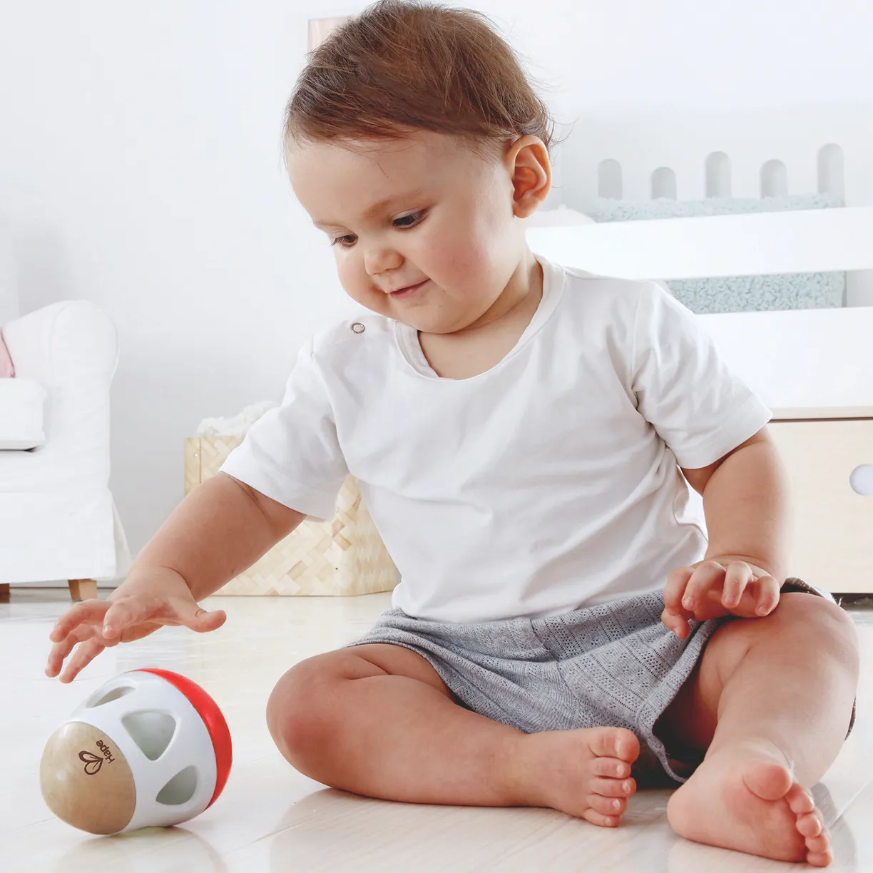 Игрушка Hape 3-в-1 погремушка-неваляшка-бумеранг "Звон колокольчика" 2